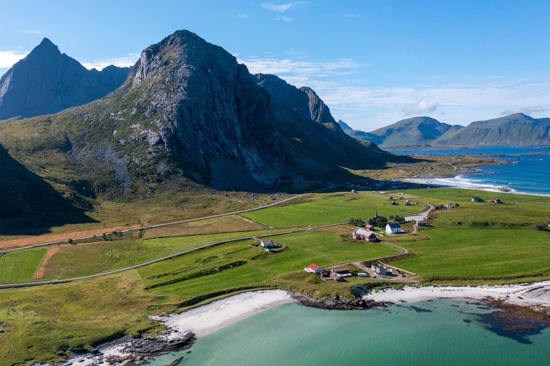 Beach and mountains in summer sunshine