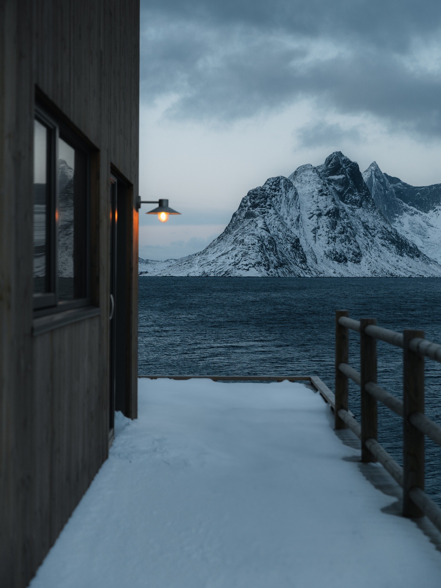 A winter morning by the sea overlooking the mountains of Lofoten